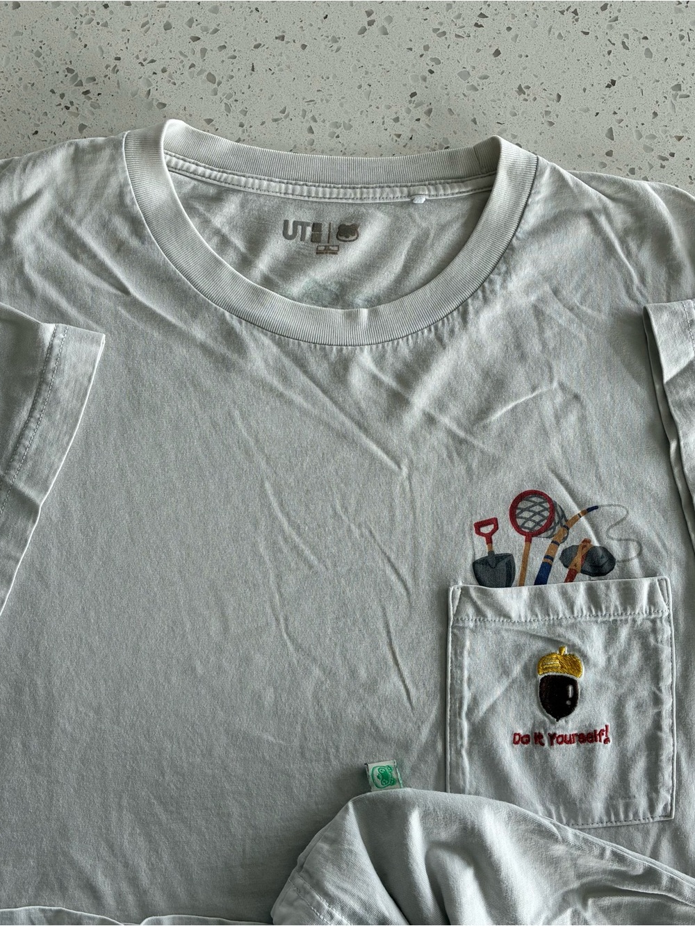 A3 - UNIQLO x ANIMAL CROSSING NINTENDO VIDEO GAME POCKET T SHIRT